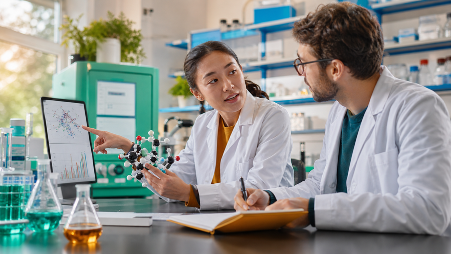 Research support specialist organizing COA, shipping, and lot information at a bright desk